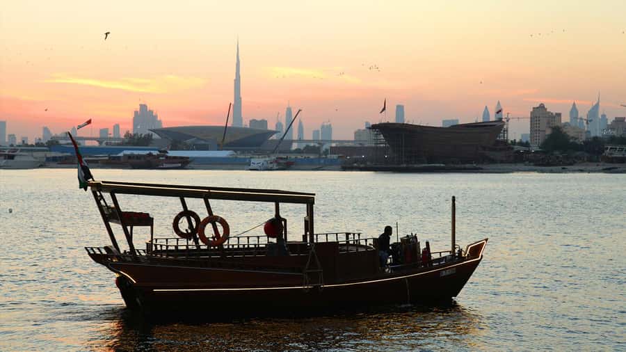 Dubai: Sunset Cruise on Traditional Boat & Emirati High Tea - Sunset Behind Burj Khalifa