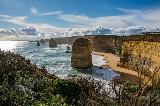 Great Ocean Road 12 Apostles & Rainforest Walk with Morning Tea - Memorial Arch explains the road itself