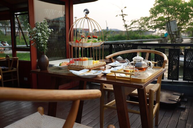 Huong River Afternoon Tea Cruise Tour Along Hue City - Quốc Học High School and the riverside monument