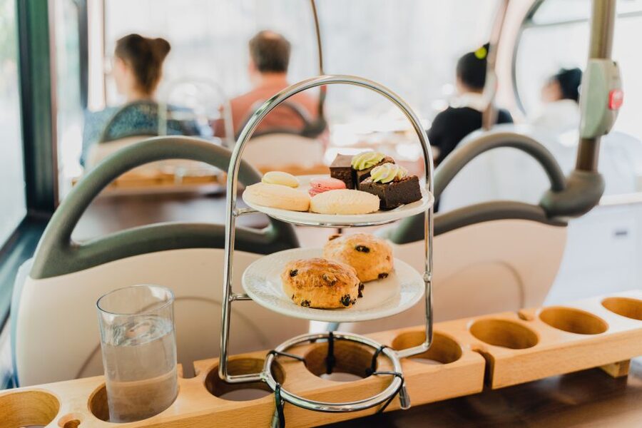 London: Afternoon Tea Bus with a Glass of Prosecco - London landmarks with a teacup in hand