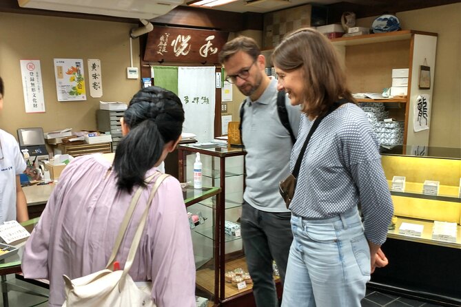 Private Hiroshima Matcha & Wagashi Experience Tour - Making matcha at a table in Nakanotana